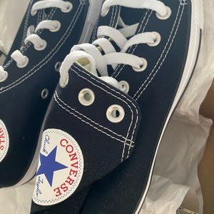 Women’s size 6.5 Chuck Taylor Black canvas high tops. BRAND NEW.